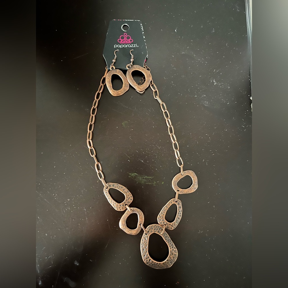 Boutique brand necklace and earrings in copper